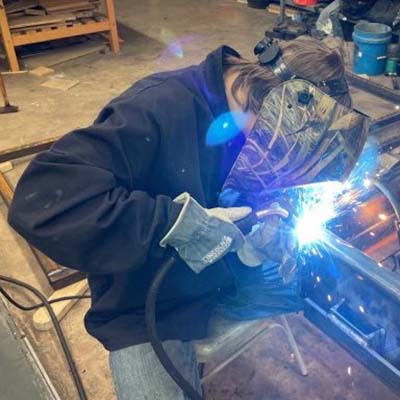 Blinn student John See IV experiencing the other side of the Ag Mechanics Project Show